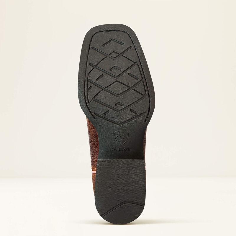 Close-up of a brown leather shoe sole with black rubber outsole on a beige background
