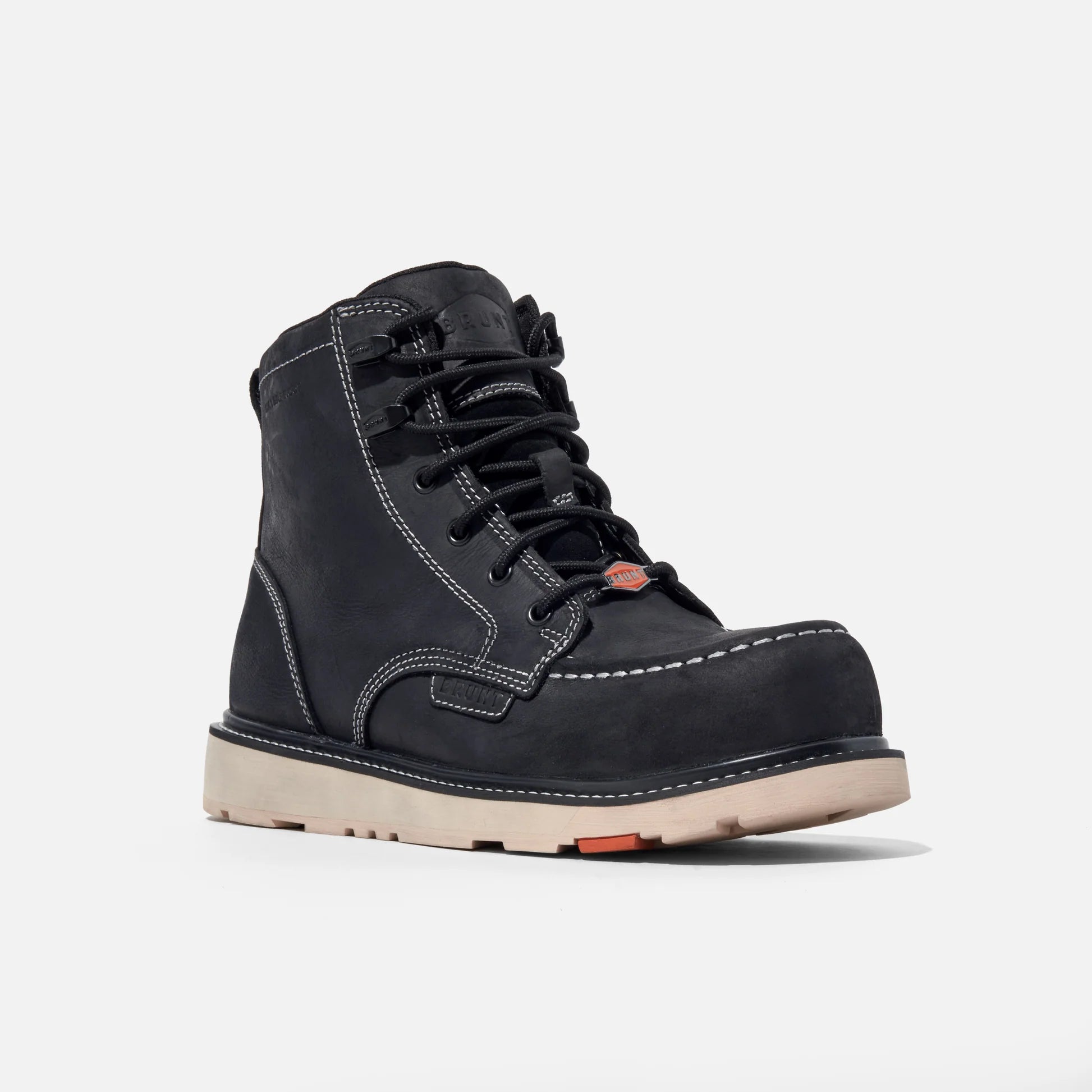 Black leather boot with white sole on a light gray background