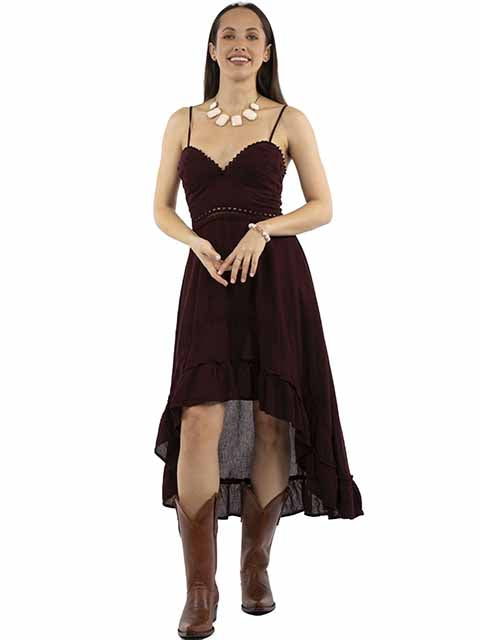 Woman wearing a burgundy dress with a high-low hemline on a white background