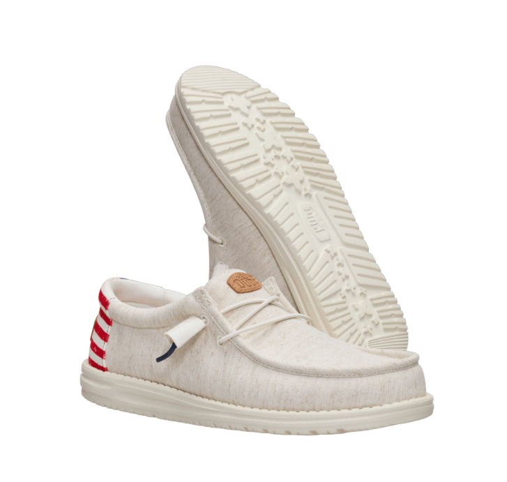 White slip-on shoes with a brand logo on a white background