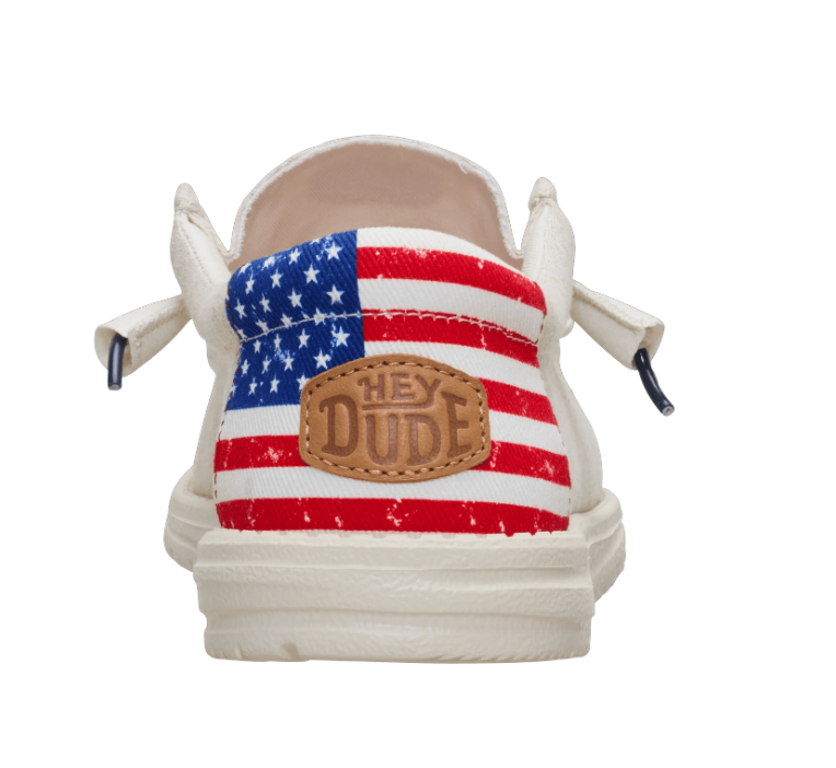 Shoe with American flag design and 'Hey Dude' label on a white background