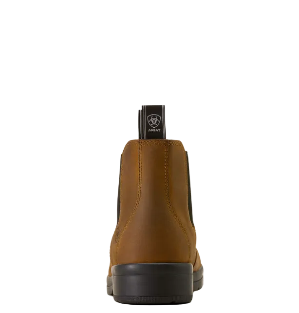 A single brown Chelsea-style ankle boot shown from the back, featuring black elastic side panels and a black pull tab with the brand name 'SOLLE' and wolf logo.