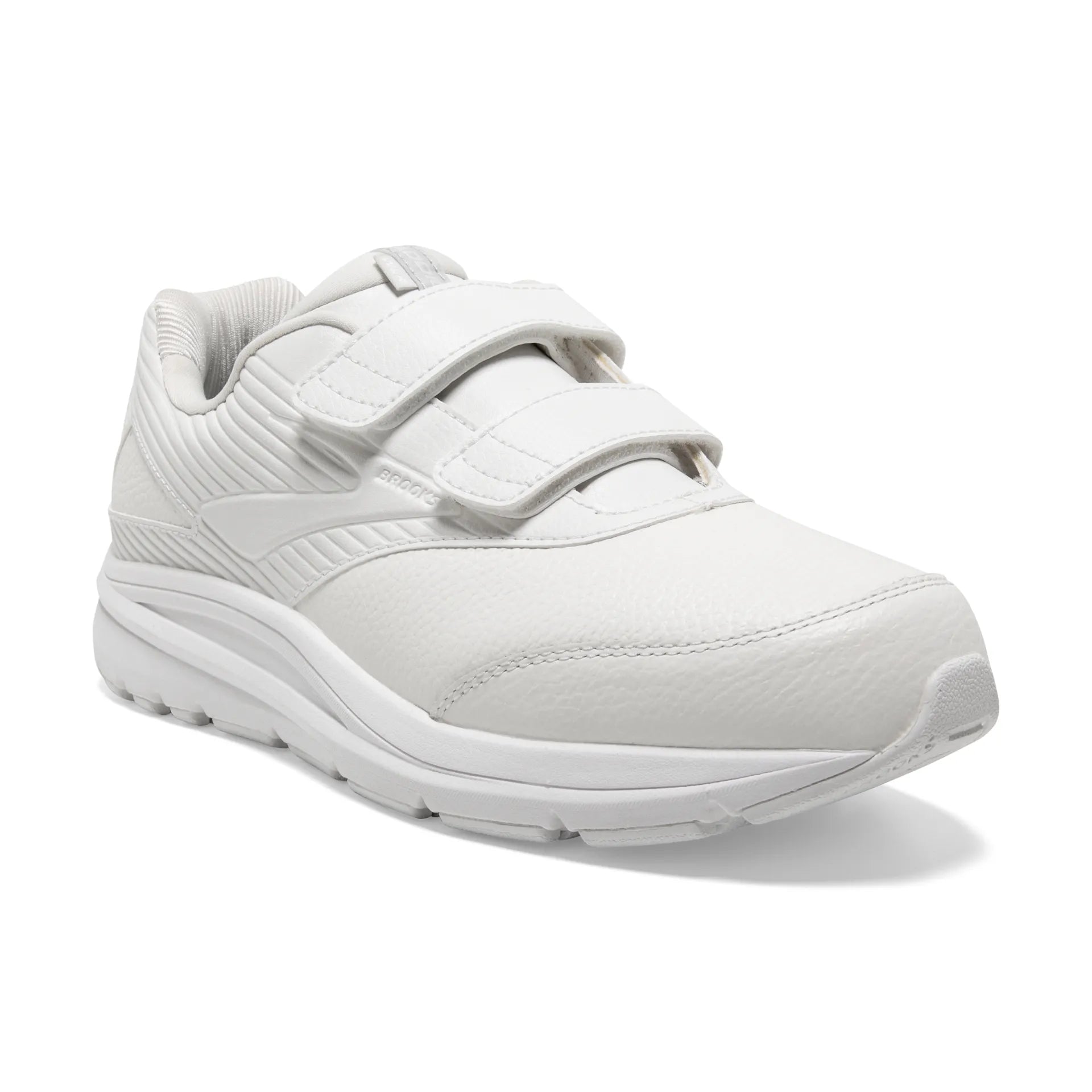 A white low-top athletic sneaker with three hook-and-loop strap closures, shown from a three-quarters angle on a white background.