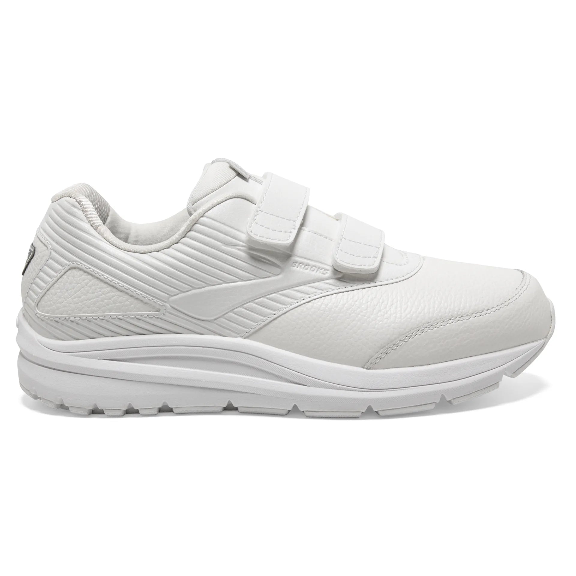 Beige running shoe with unique sole design on a white background