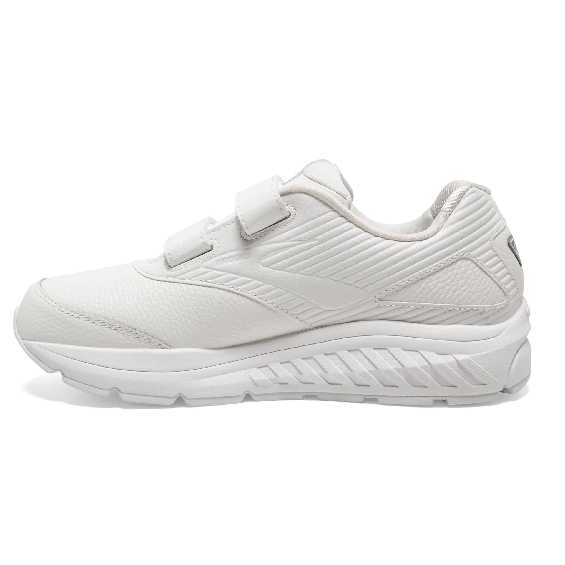 White athletic shoe with a strap on a white background