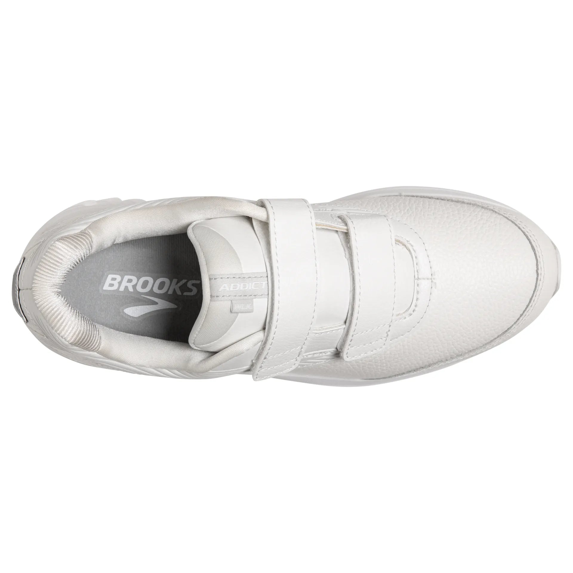 A white Brooks athletic shoe with two hook-and-loop straps, shown from a top-down view on a white background.