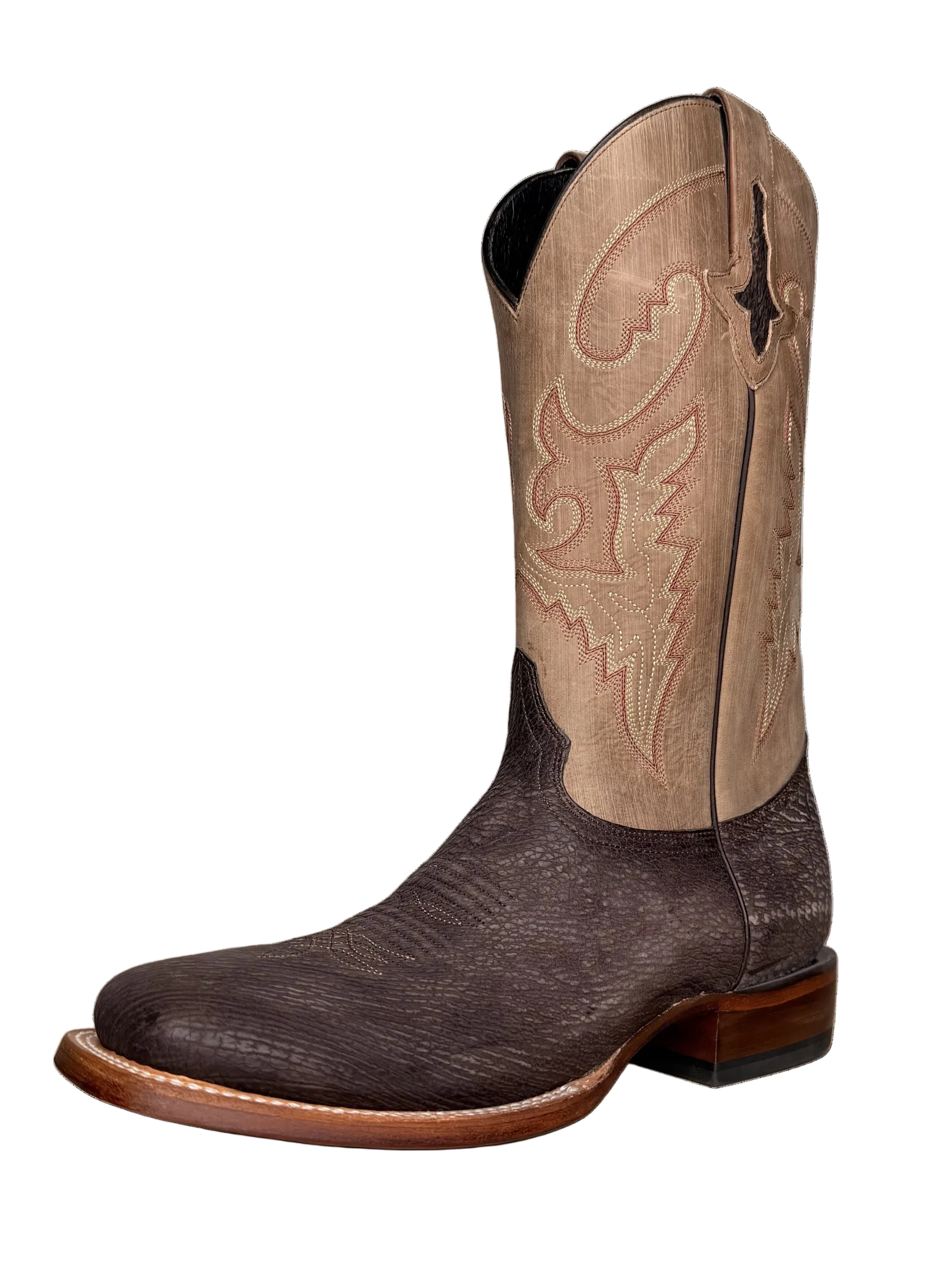 Brown and beige cowboy boot on a white background