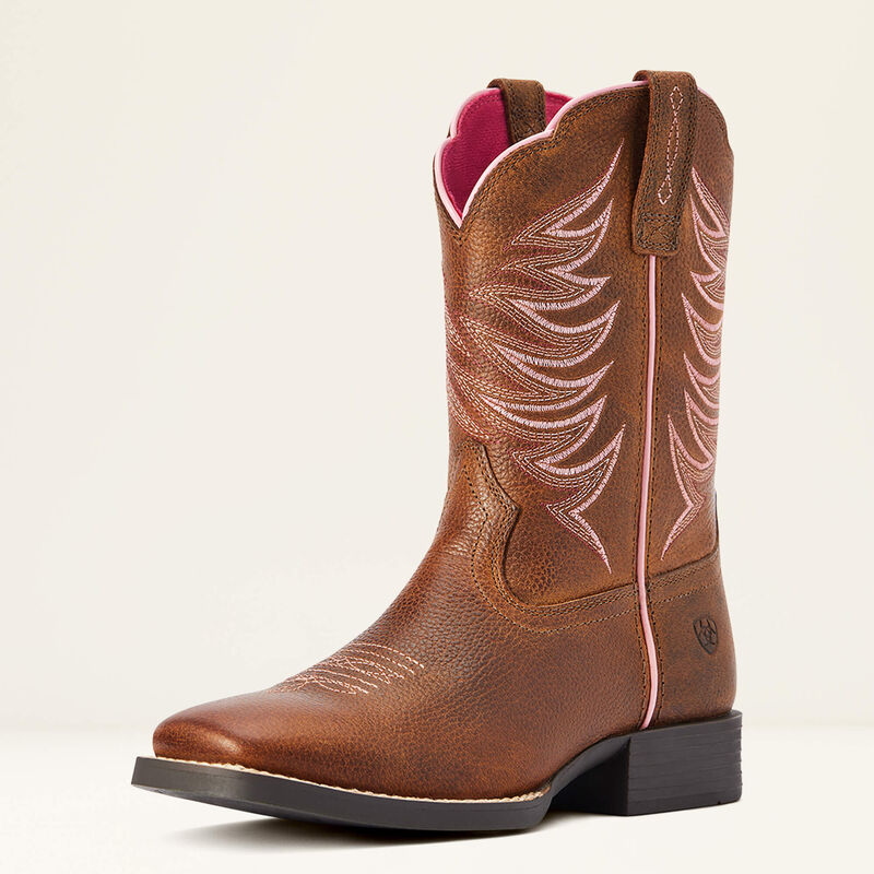 Brown cowboy boot with intricate white stitching on a beige background