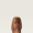 Close-up of a brown leather boot sole on a beige background