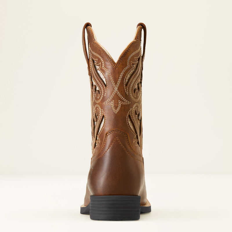 Brown cowboy boot with intricate design on a white background