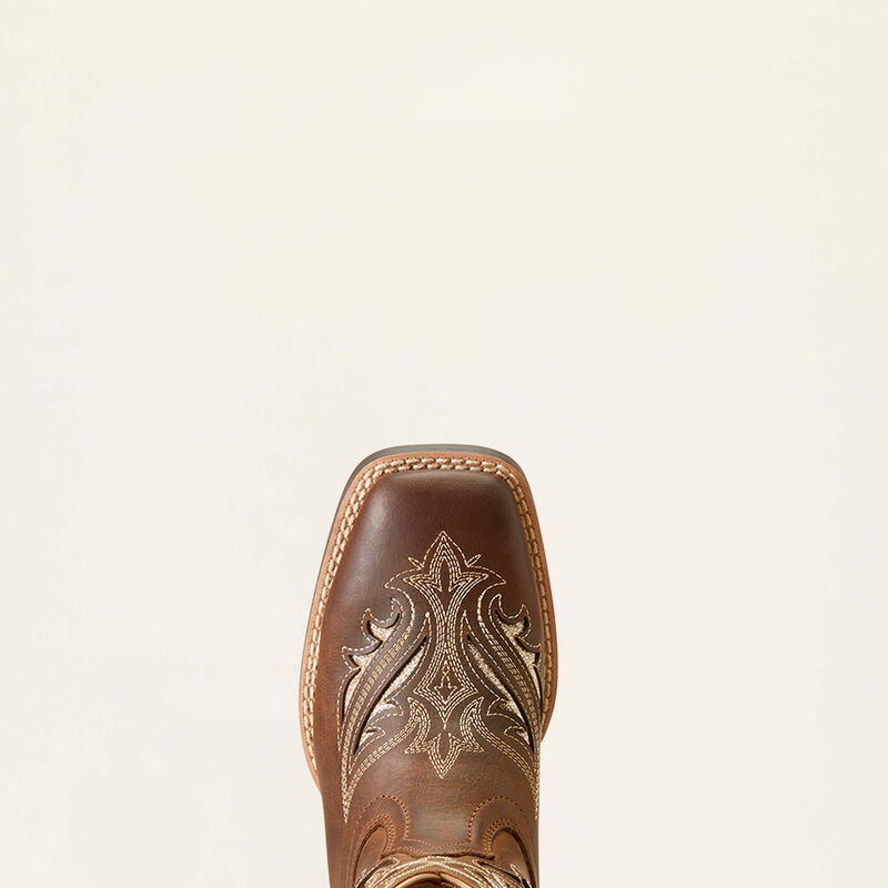 Brown leather boot with intricate embossing on a beige background