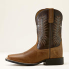 Brown cowboy boot with intricate stitching on a white background