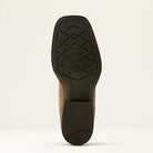 Close-up of a shoe sole with a brand logo on a light beige background