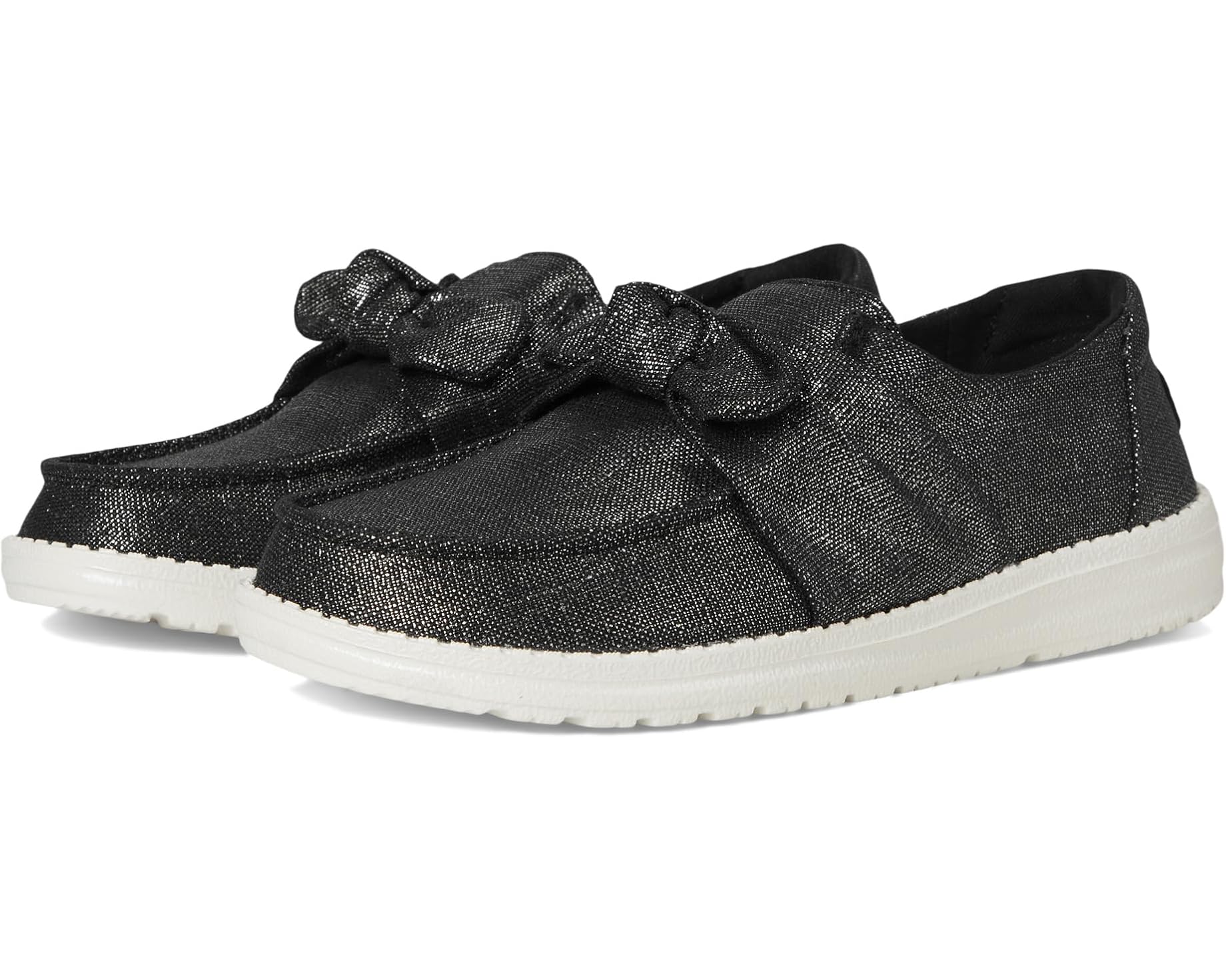 Black loafers with a bow on a white background