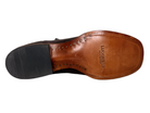 Brown leather shoe sole with black rubber sole on a white background