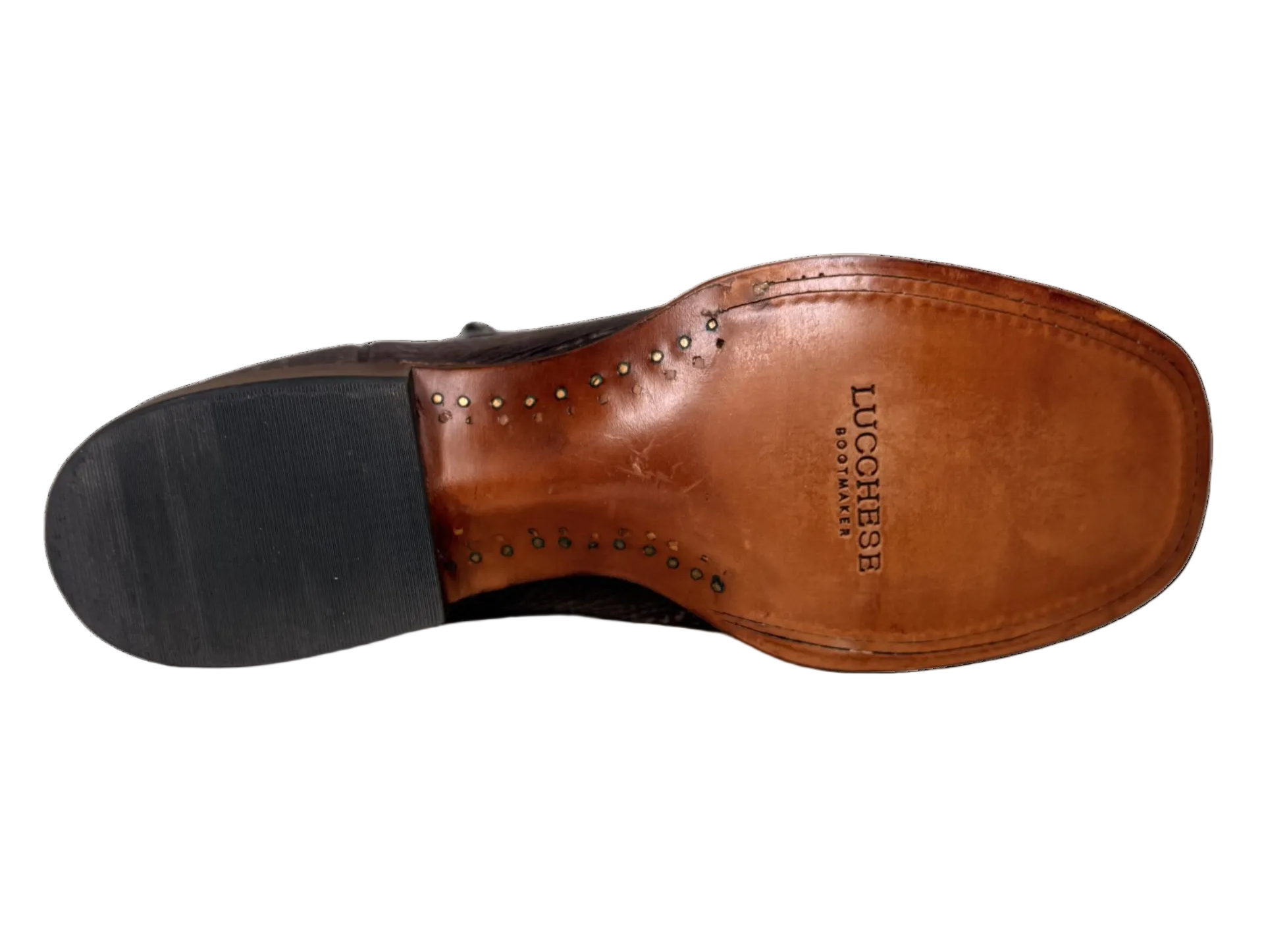 Brown leather shoe sole with black rubber sole on a white background
