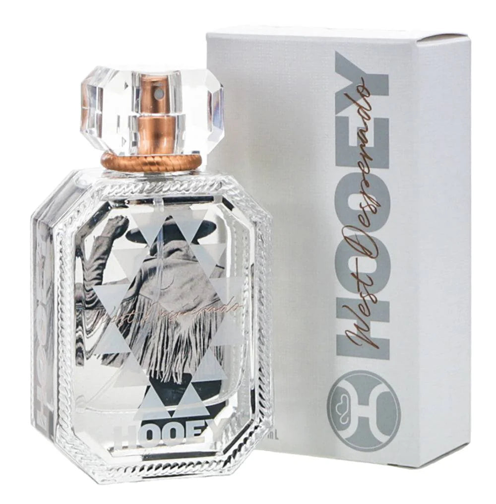 Perfume bottle with decorative label and matching box on a white background
