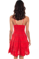 Red dress with lace details on a white background