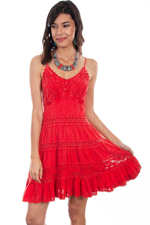 Woman wearing a red lace dress on a white background