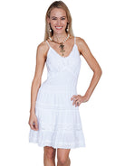 Woman wearing a white dress on a white background