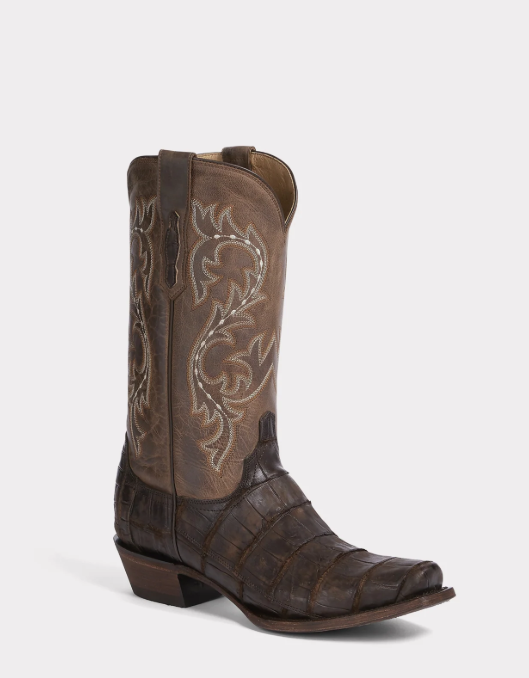 Brown cowboy boot with intricate design on a white background