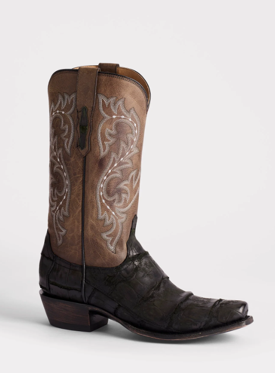 Brown cowboy boot with intricate white embroidery on a white background