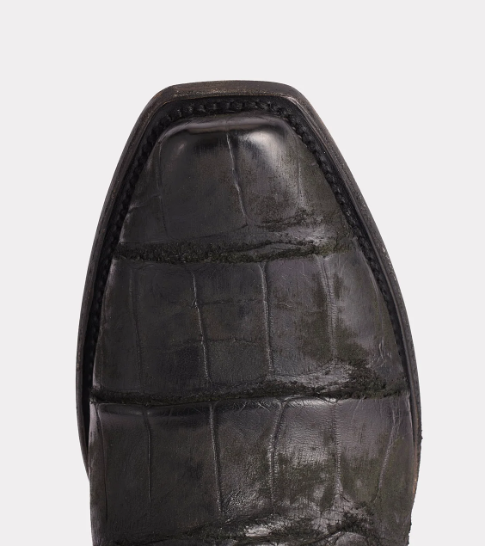 Close-up of a black leather shoe sole on a light gray background