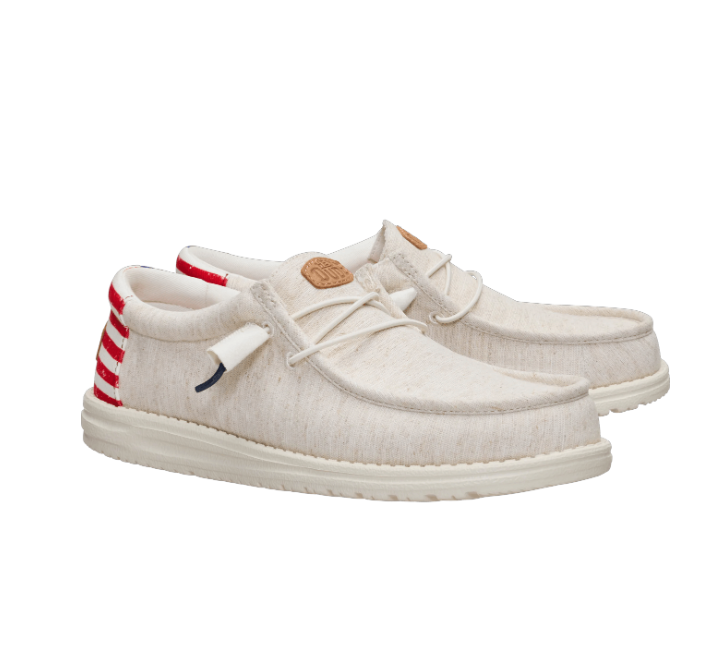 White sneakers with red and blue accents on a white background