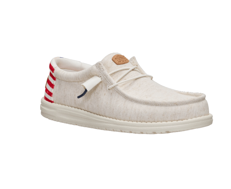 white hey dude with red and white stripes on heel. on a white background