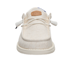 White sneaker with a visible brand logo on a white background