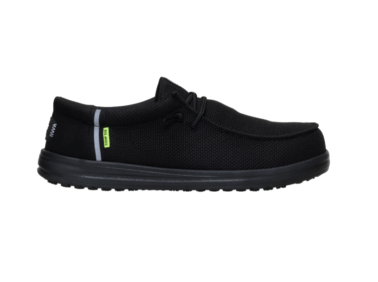 Black slip-on shoe with a small green tag on a white background