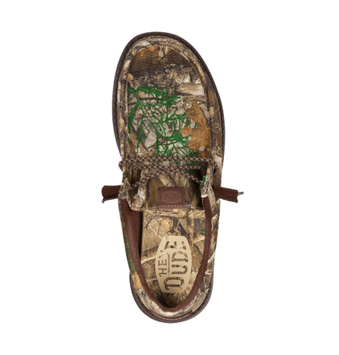 Camouflage-patterned sandal with brand logo on a white background