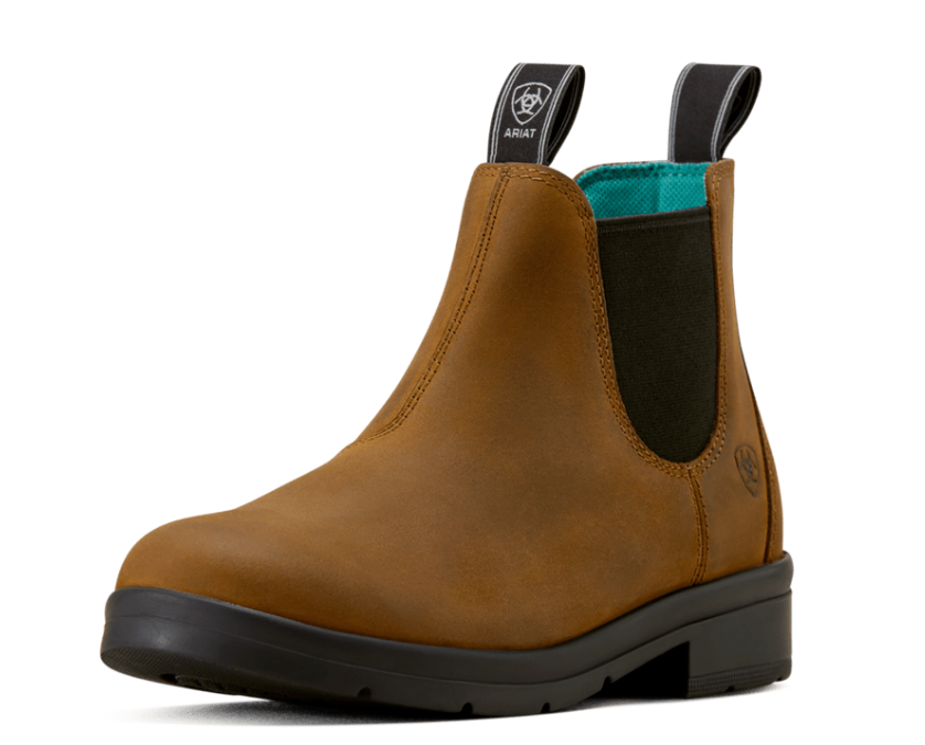 A single brown leather Chelsea boot with black elastic side panels and a black sole, shown from a three-quarter angle on a white background. The brand Timberland is visible on the pull tabs and side logo.