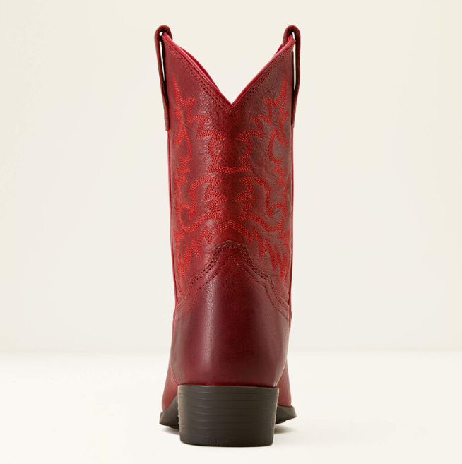 A single red leather cowboy boot shown from the back, featuring a dark brown stacked heel and a subtle tonal western pattern on the shaft, set against a plain off-white background.