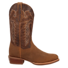 A single brown leather cowboy boot with decorative white stitching on the shaft, shown in side profile against a dark blue background. A Dan Post logo is visible in the bottom-left corner.