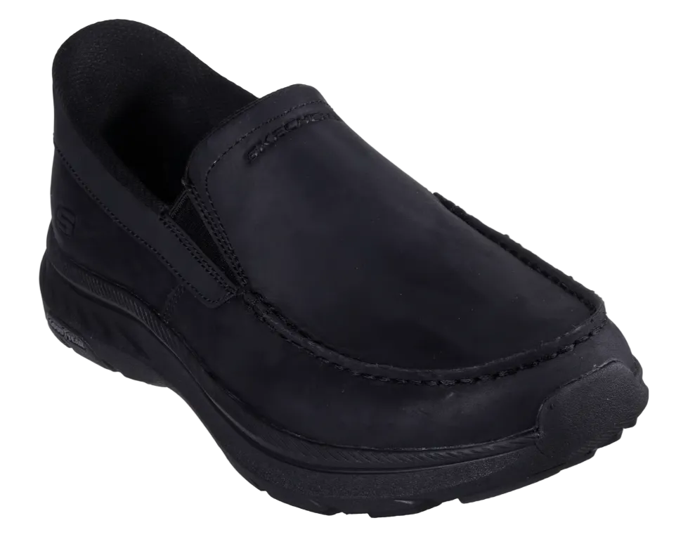 A single black slip-on loafer shoe with a matte finish, photographed from a three-quarters angle against a plain white background.