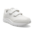 A white low-top athletic sneaker with three hook-and-loop strap closures, shown from a three-quarters angle on a white background.